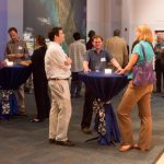 Students speaking at a table
